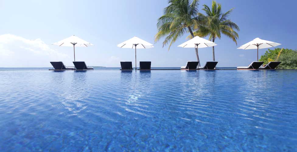 Sun loungers at pool