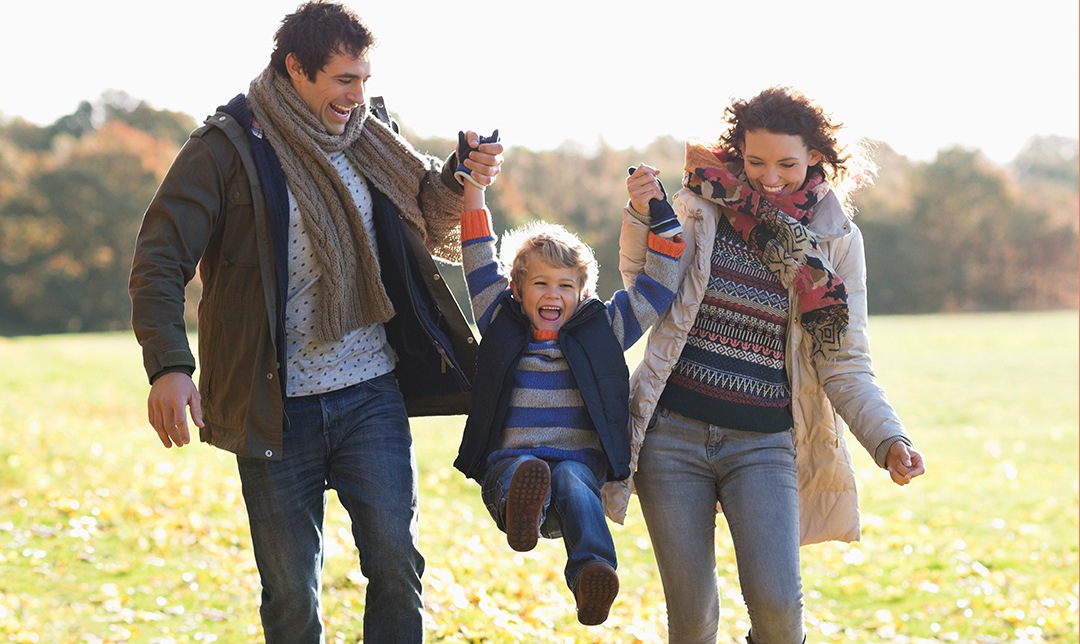 Father and mother playing with child