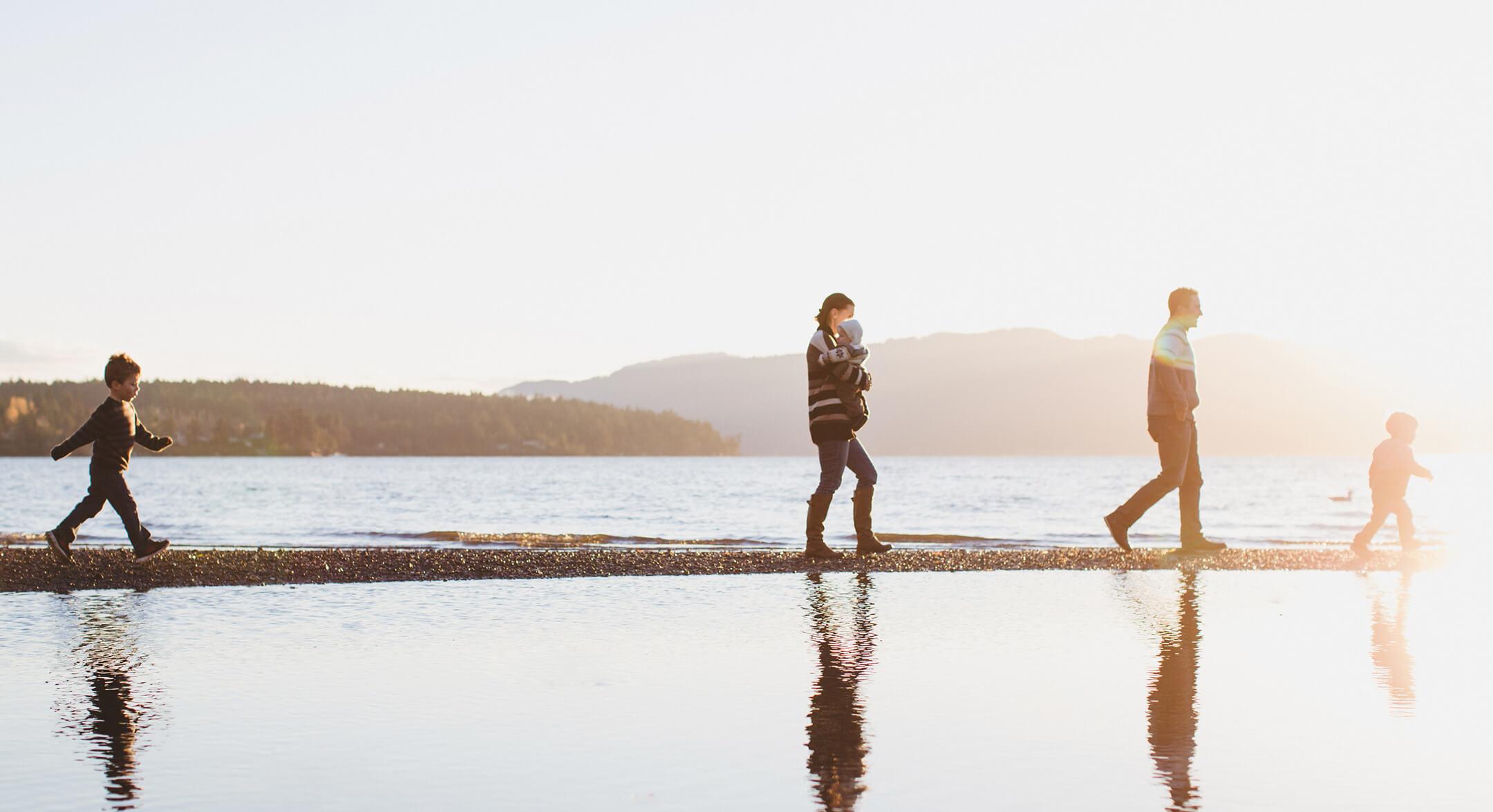 A family walking along a beach